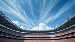 Empty football stadium with blue sky, representing Farrer & Co's sports law practice
