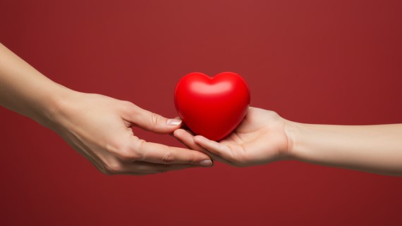 Hands with a red apple