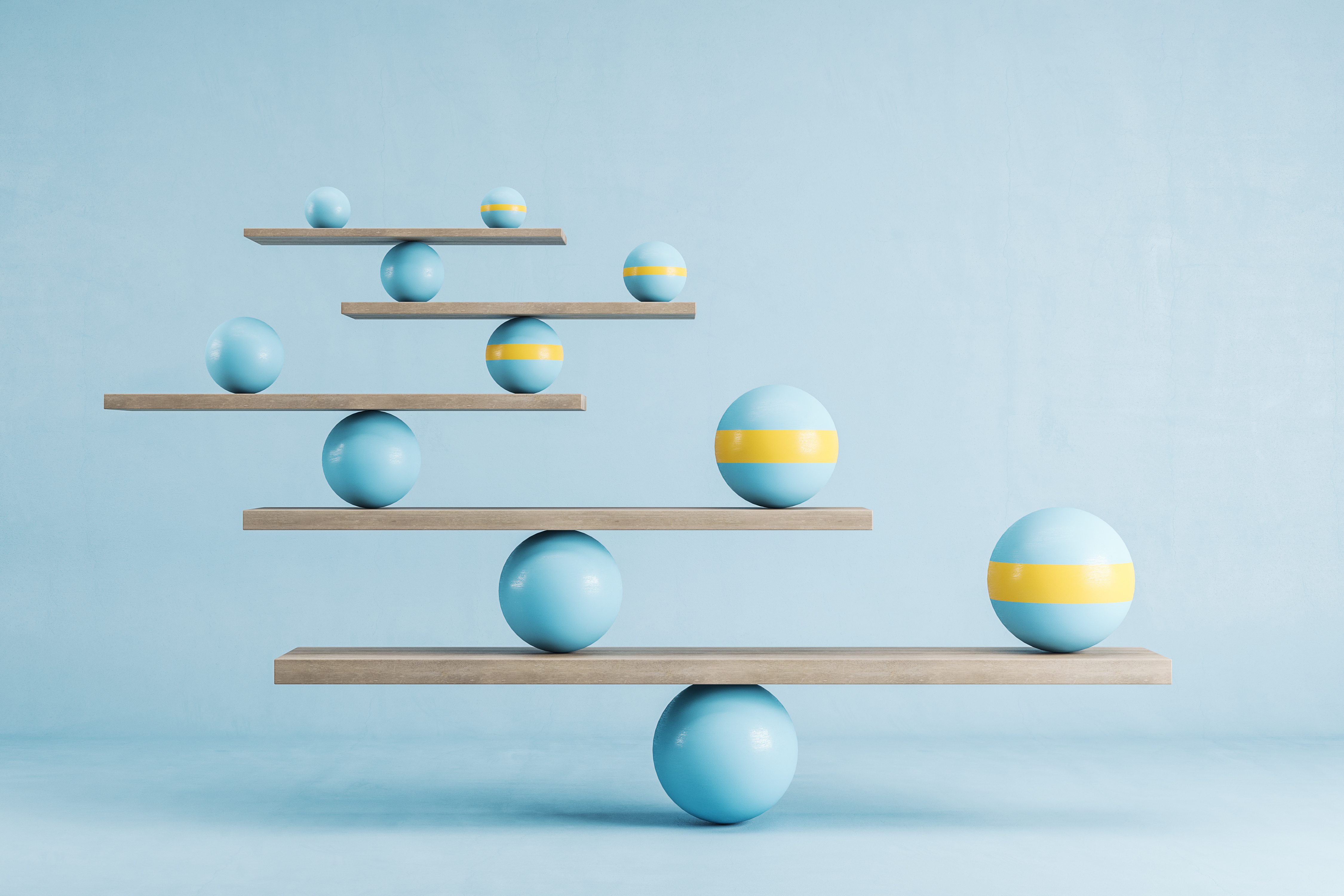 balanced scales with different sized balls