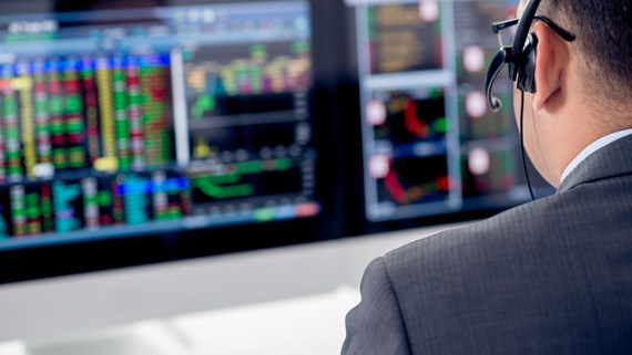 Man in front of computers