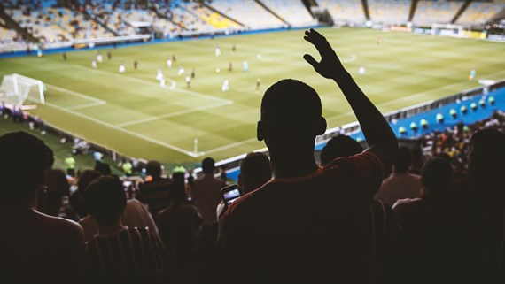 Crowded football stadium with supporters in the stands, illustrating terrorism protection and security planning considerations for sports venues under Martyn's Law.