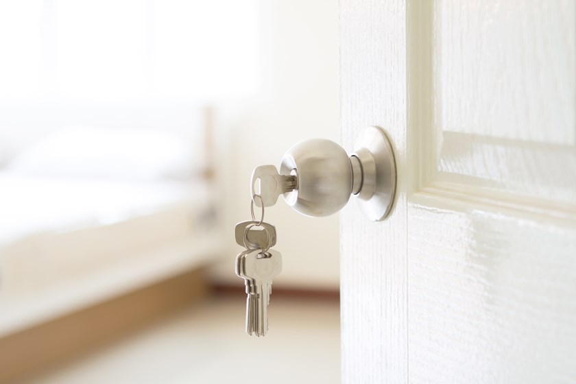 House keys hanging from front doors, representing ownership, property interests and family home disputes following divorce proceedings.