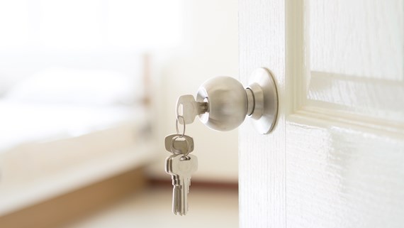 House keys hanging from front doors, representing ownership, property interests and family home disputes following divorce proceedings.