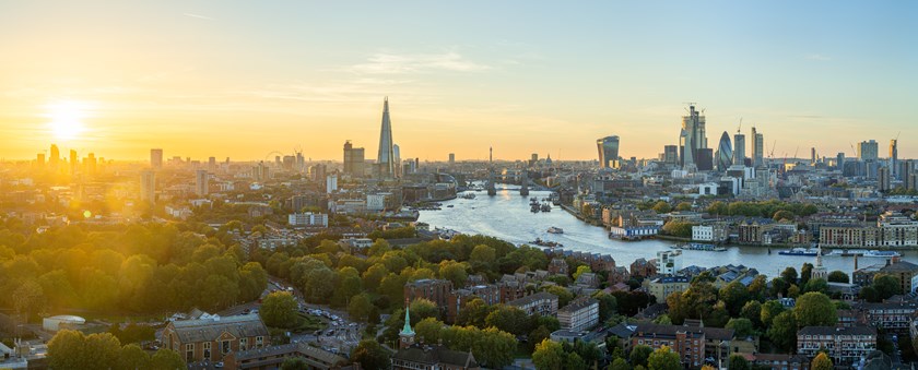 Aerial view of the City of London skyline at sunset, illustrating London's appeal as a destination for international investment, prime real estate and luxury assets.