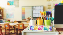 Early years classroom with colourful pencils, reflecting safe and supportive early learning practice