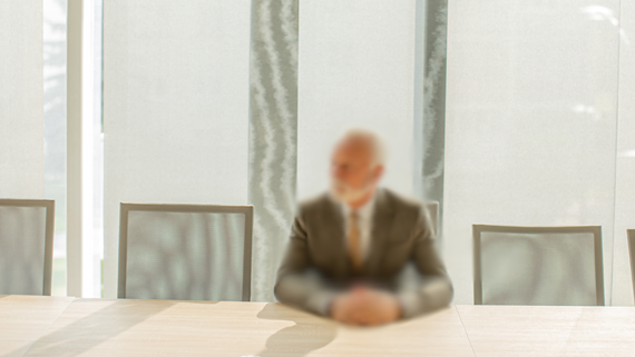 blurred man in boardroom